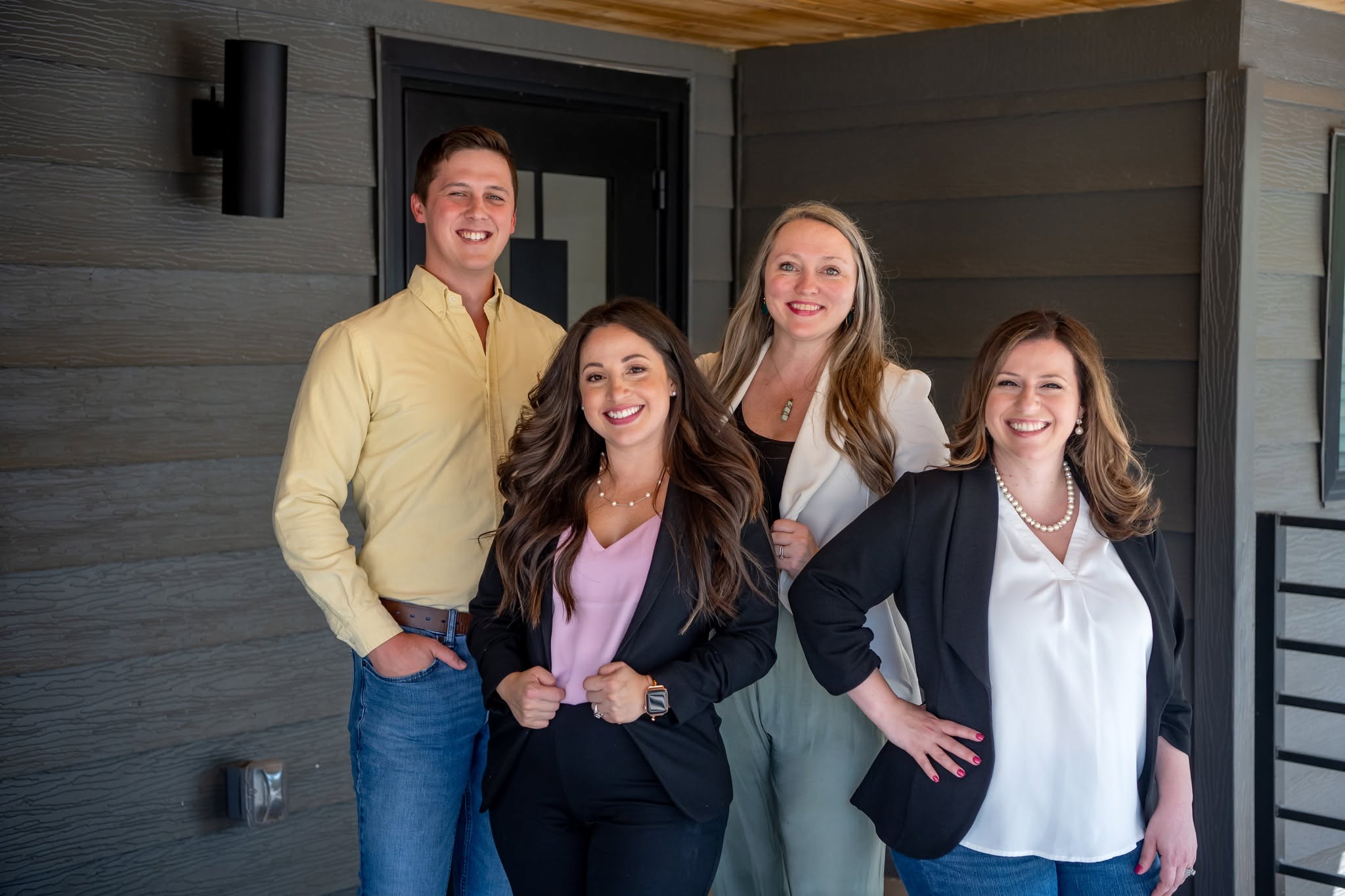 The Kimi Does Mortgages team on a Fort Worth front porch